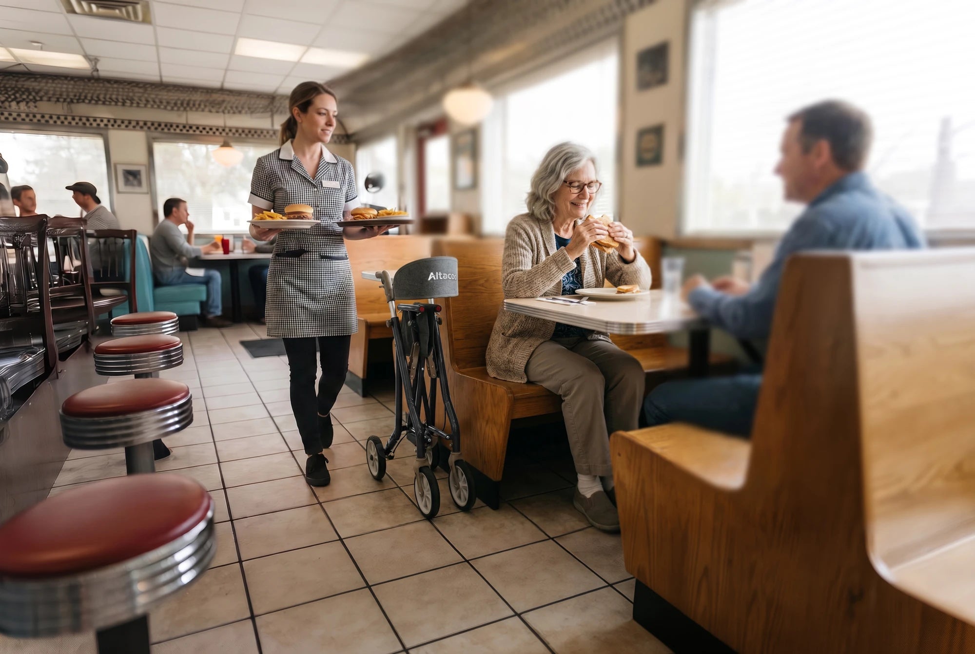 Folded rollator parked beside a booth in an American diner